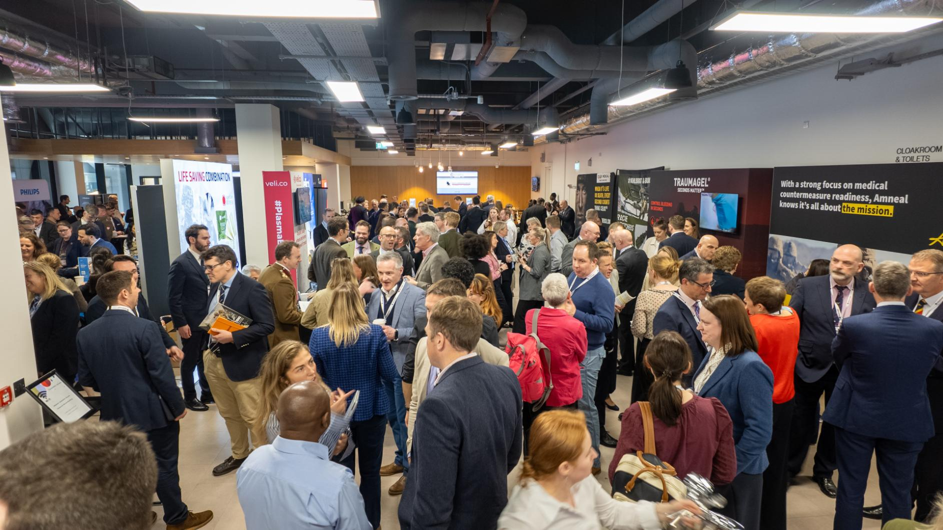 A busy exhibition space at Deployed Medical & Healthcare Delivery