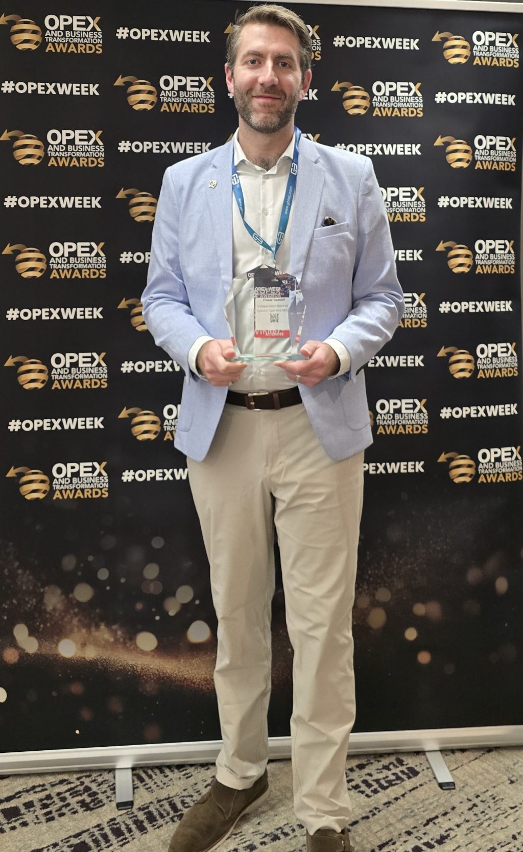 Fraser collecting the Business Transformation Leader of the Year award from the 2025 Business Transformation World Summit.