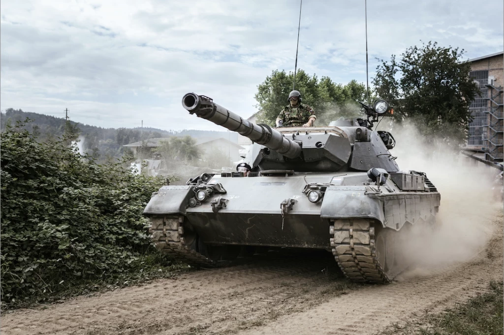 A man driving a tank