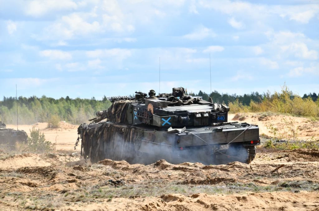 A tank driving along the road in Lithuania