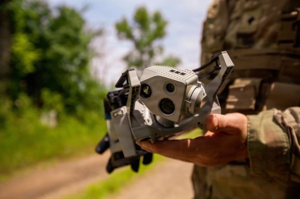Man holding counter UAS Technology