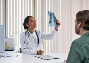 Doctor looking at x-ray