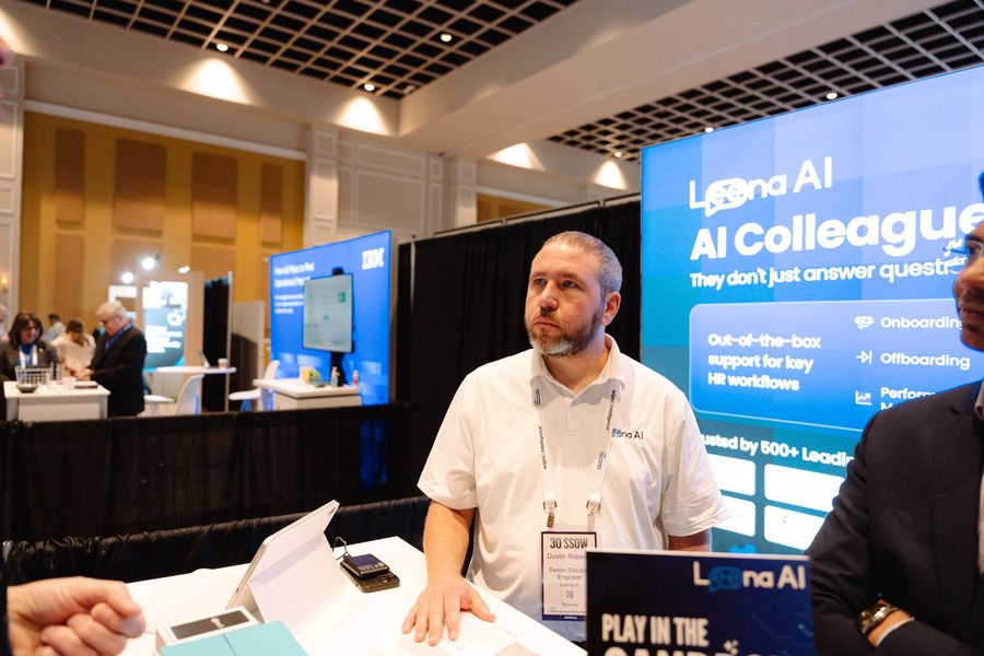 1:1 booth conversation between attendee and sponsor at SSOW