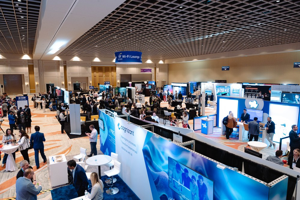 Wide shot of SSOW expo hall with Capgemini and EY stands