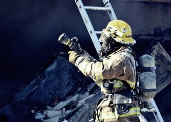 Firefighter holding hose