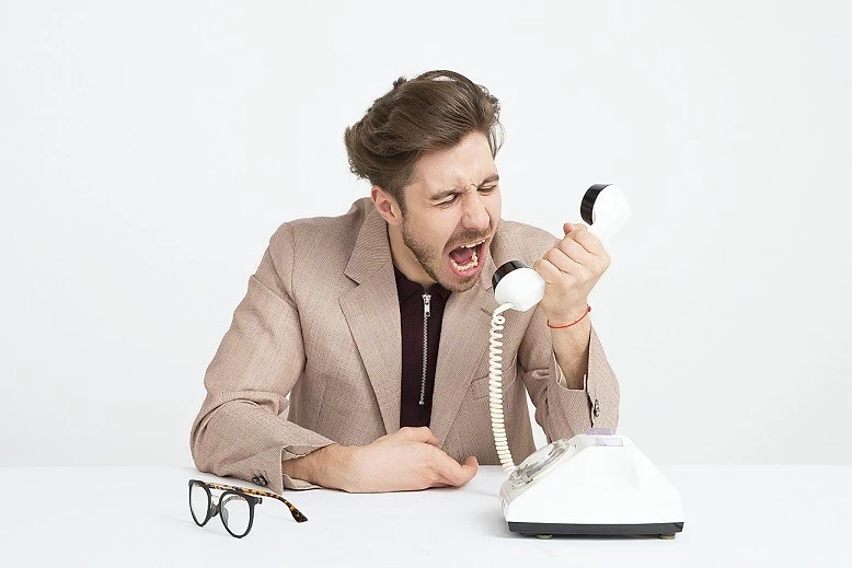 man shouting into phone man shouting into phone