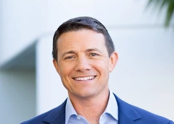 picture of man in suit smiling