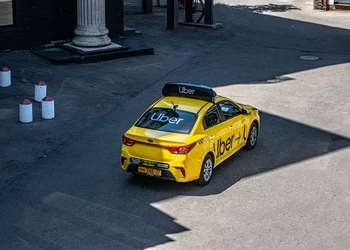Aerial view of Uber taxi on road
