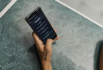 person using ChatGPT on phone