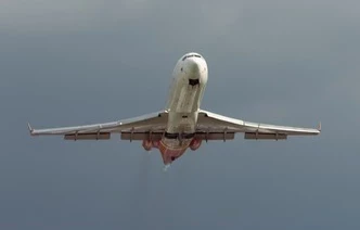 plane during takeoff against blue sky