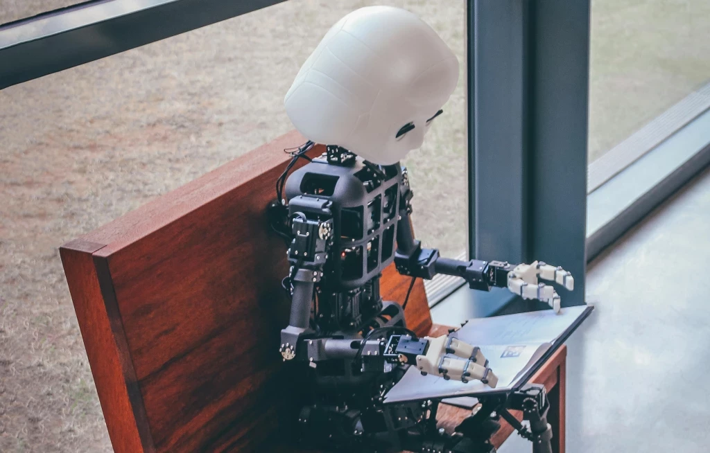 robot reading an iPad