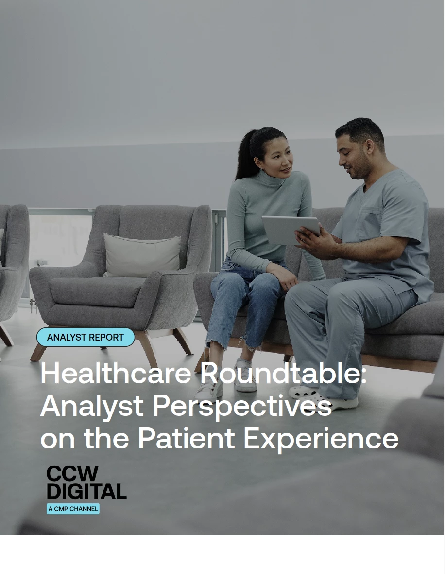 Patient speaking with a healthcare provider reviewing information on a tablet in a healthcare waiting area.
