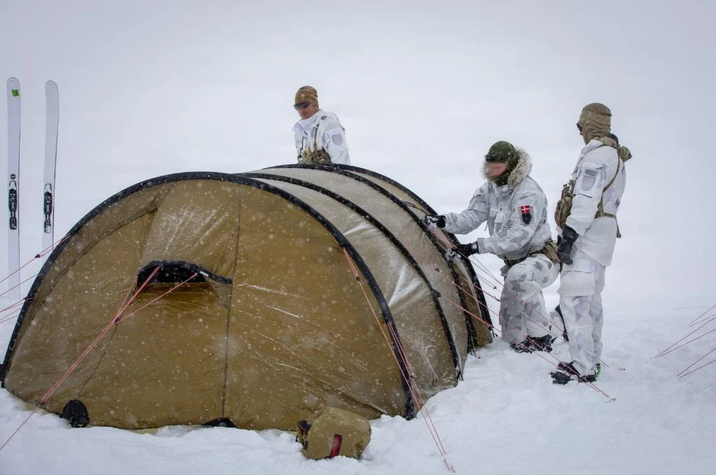 Three army men with a tent in the arctic
