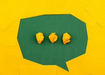 green speech bubble on yellow background
