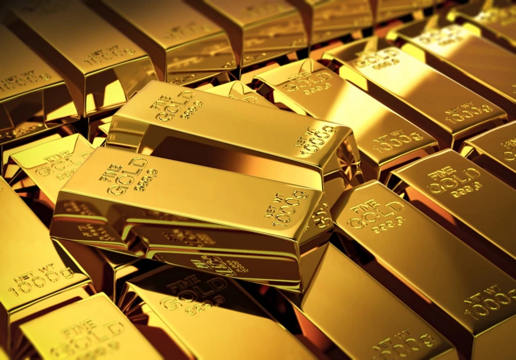 Why Coaching really matters_2 gold bars stacked on a pile of other gold bars