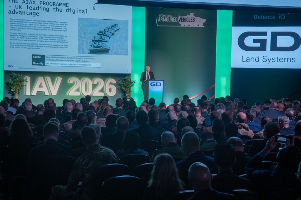 A packed IAV auditorium during a strategic briefing