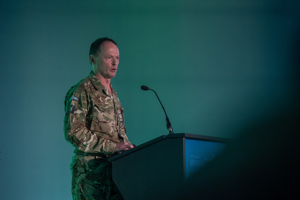 Senior military leader speaking on stage