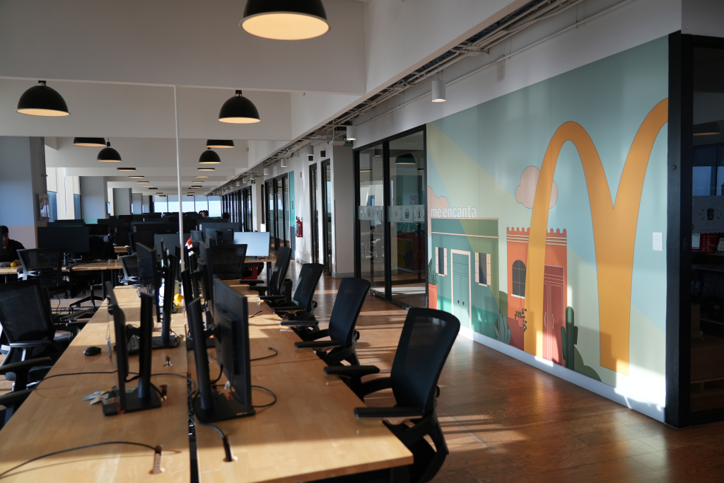 McDonald's office open workspace with branded mural